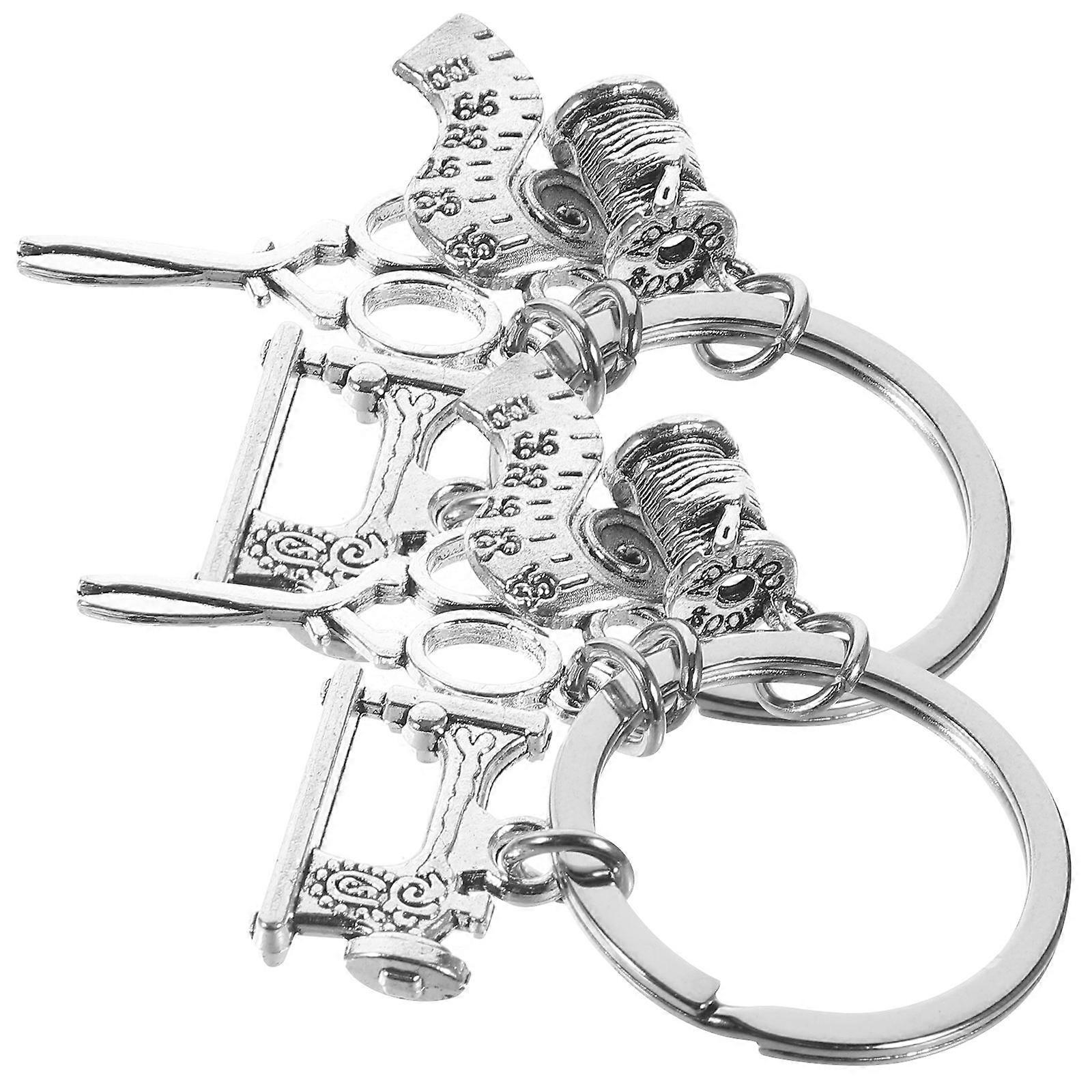 Here's a polished and professional product description based on your input:

 

**2pcs Sewing Machine Scissors Ruler Key Chain – Alloy Bag Pendant