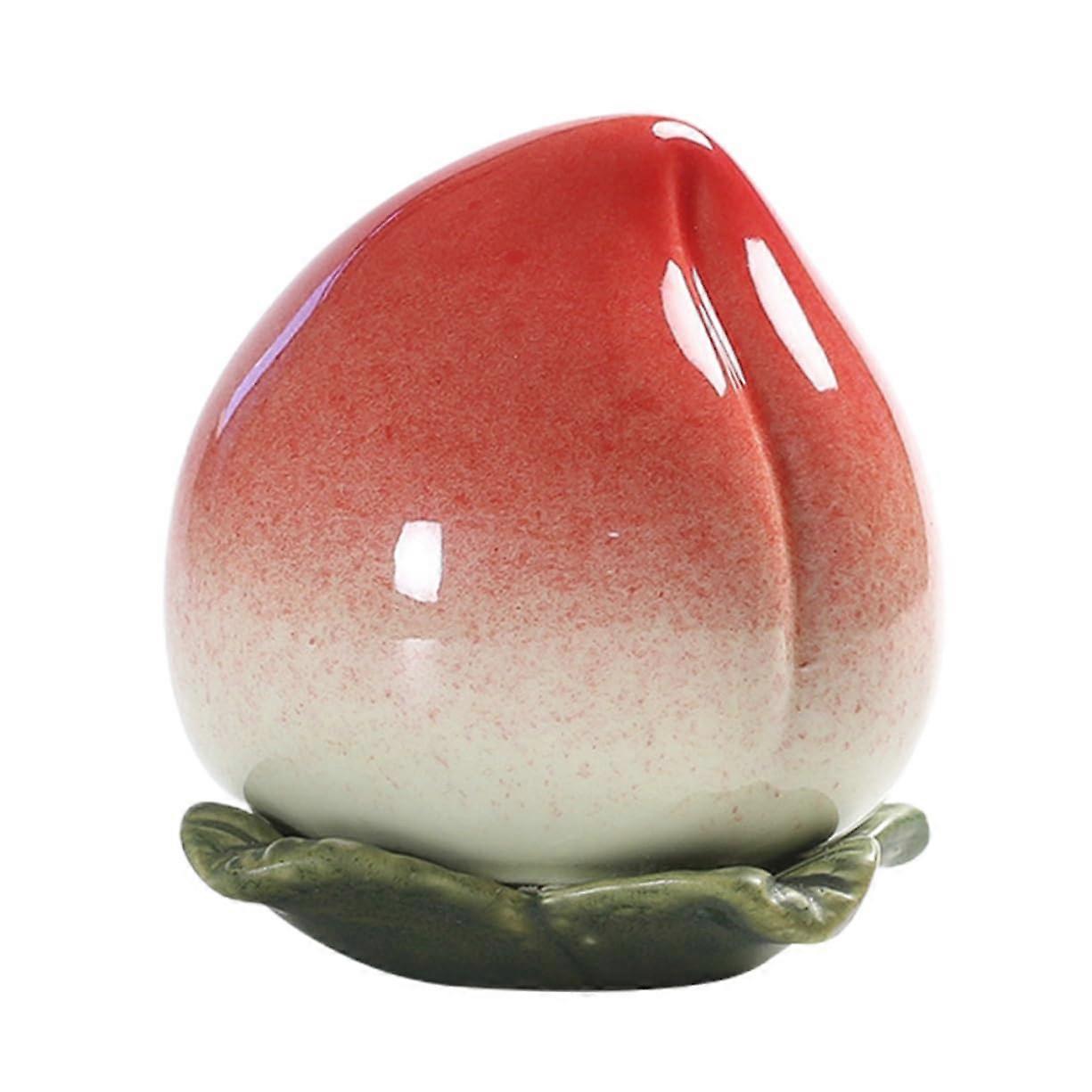 Decorative ceramic tea canister in peach shape, airtight container for tea and snacks, creative gift idea for birthdays, durable and easy to clean.