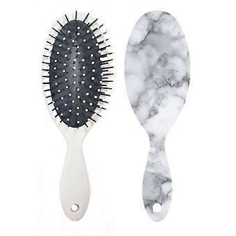 Escova de cabelo com textura de mármore para massagem no couro cabeludo e cuidados com os cabelos.