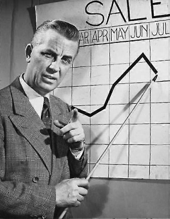 Businessman Pointing At A Line Graph During A Presentation Poster