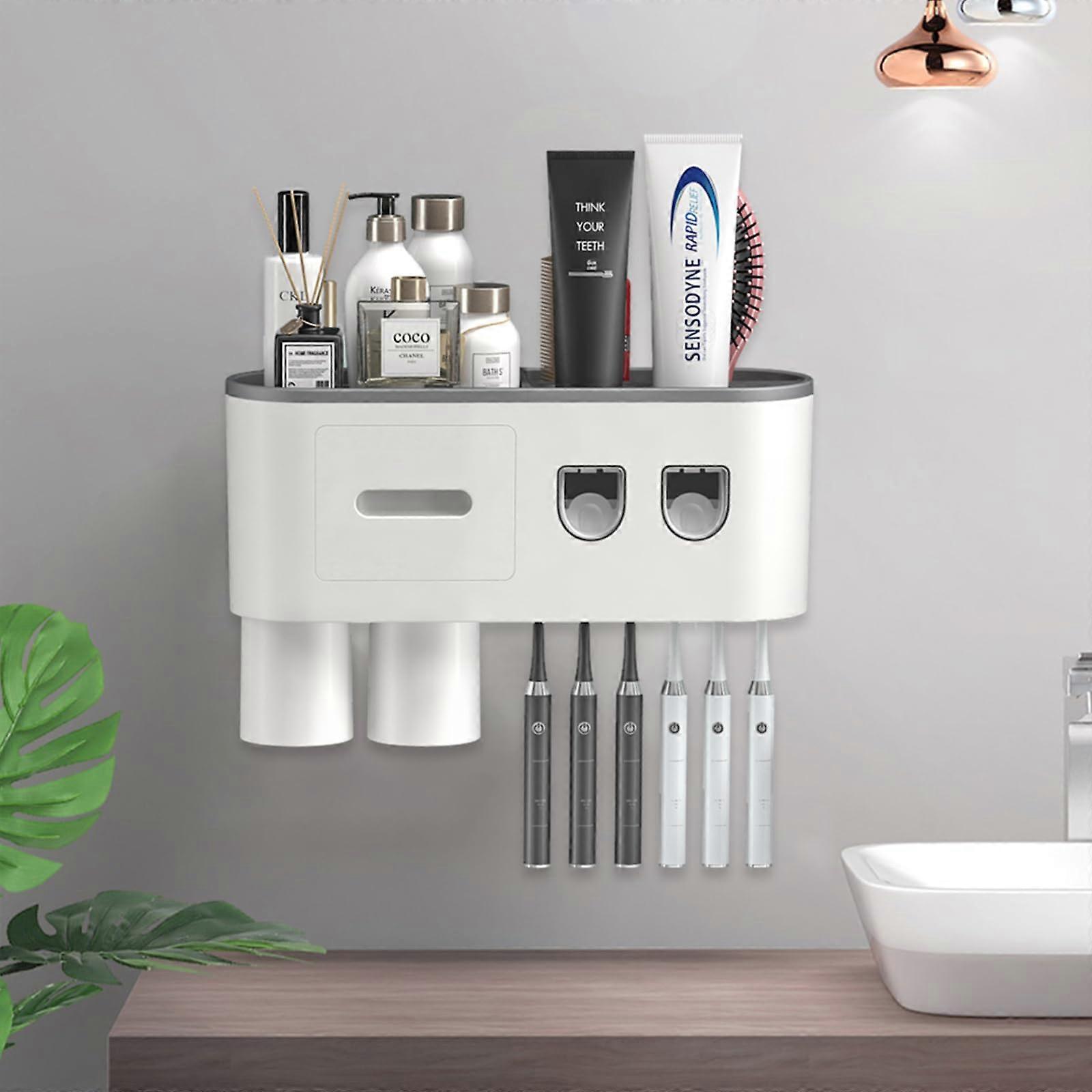 Wall-mounted toothbrush holder with double automatic toothpaste dispenser  including toothpaste set.
