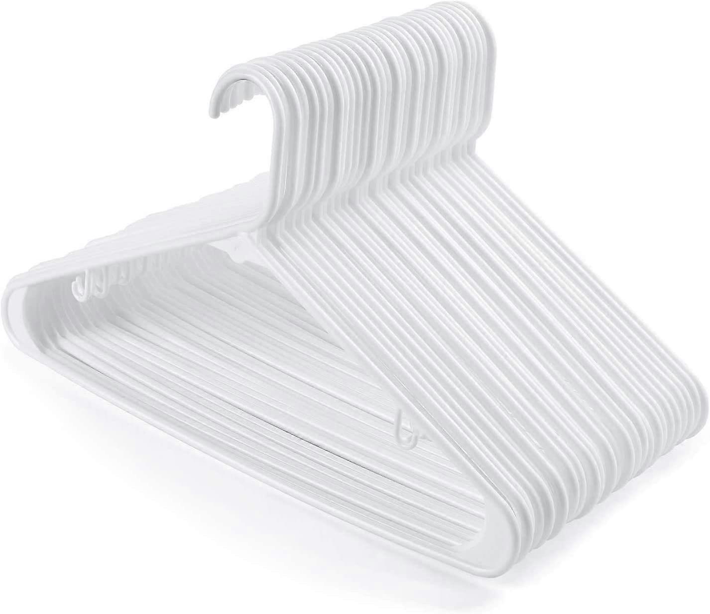 Sett med 24 plasthengere, buksehenger