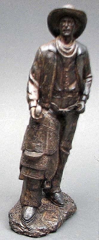 Cowboy aspect bronze avec selle