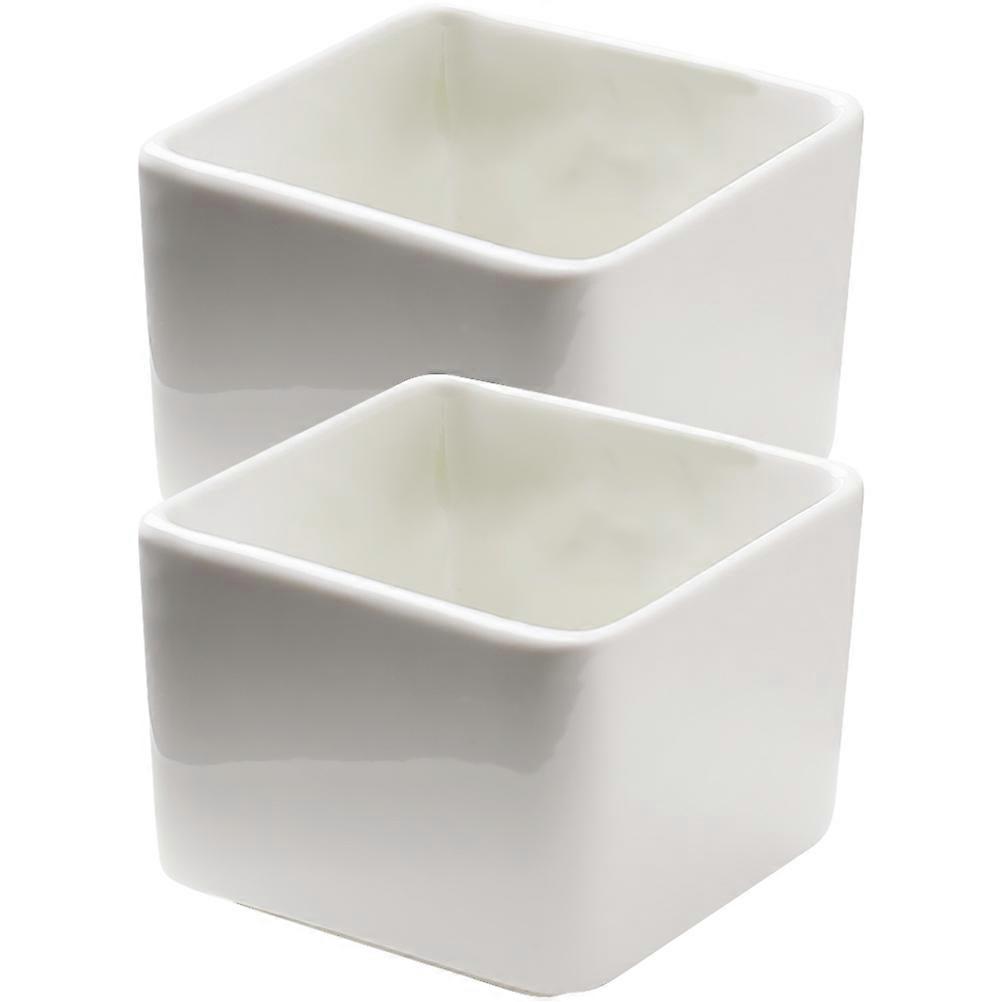 Here's a refined and professional product description based on the title you provided:
**2pcs Creative Ceramic Square Dipping Bowls – Wear