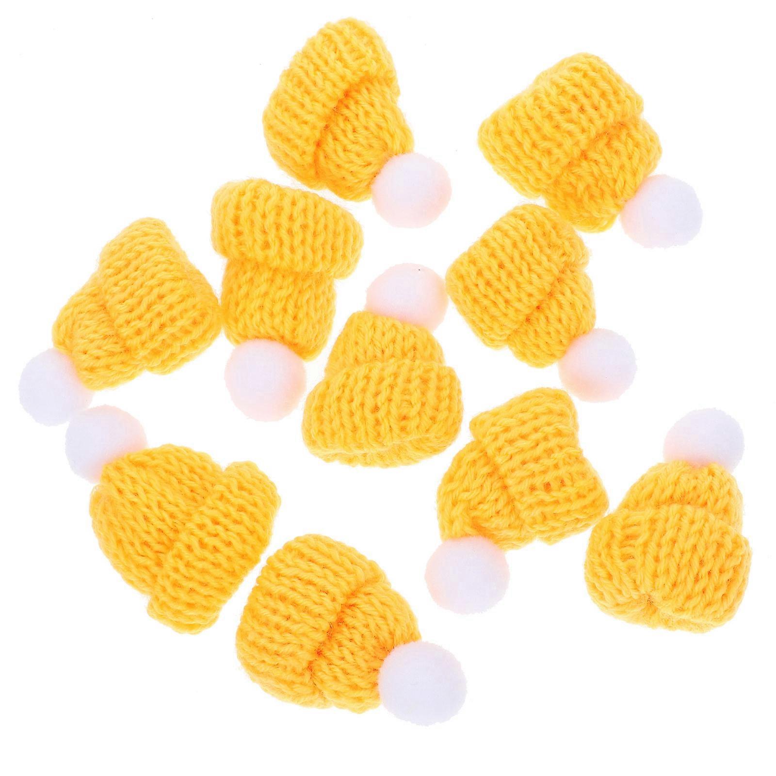 قبعة عيد الميلاد الصغيرة صور الدعامة مناسبة لحفلة عيد الميلاد وأنشطة DIY تتميز بشرابة مستديرة باللون الأصفر 10 قطع