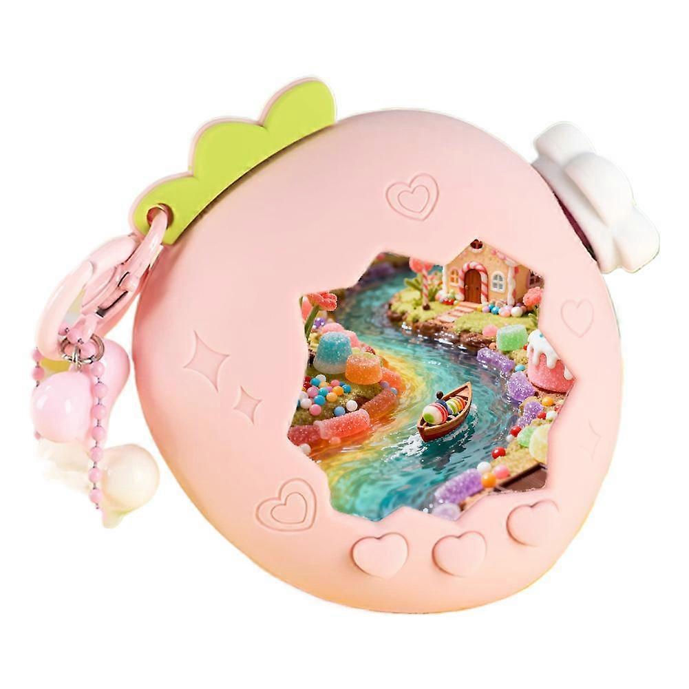 Tamagotchi Paradise Strawberry -koteloon, jossa on näytönsuoja, papeririipus ja lisävarusteet