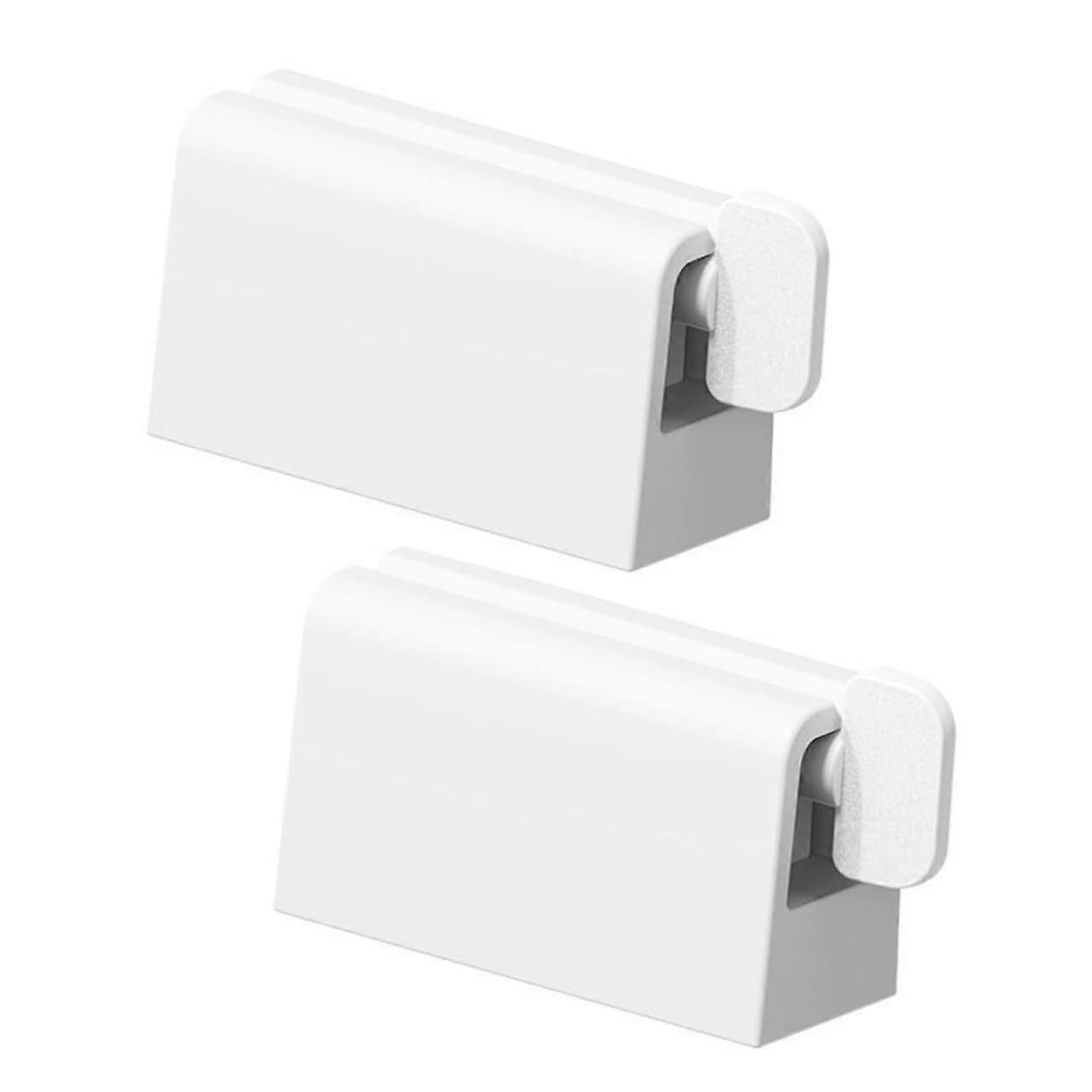 Practical wall toothpaste dispenser, automatic toothpaste squeezer for easy operation and spacesaving design for hygienic bathroom organization.