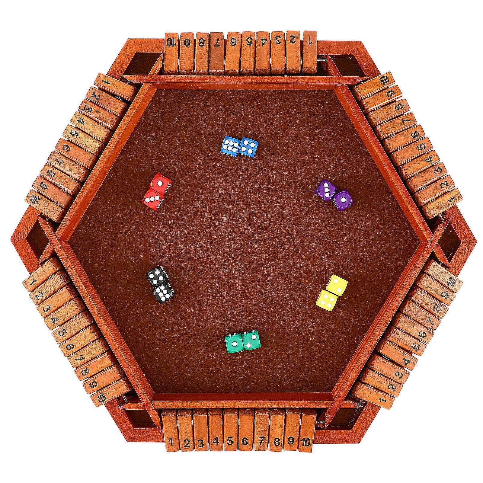 It sounds like you're describing the classic game **"Shut the Box"**, a popular wooden board game that combines elements of strategy, luck, and math