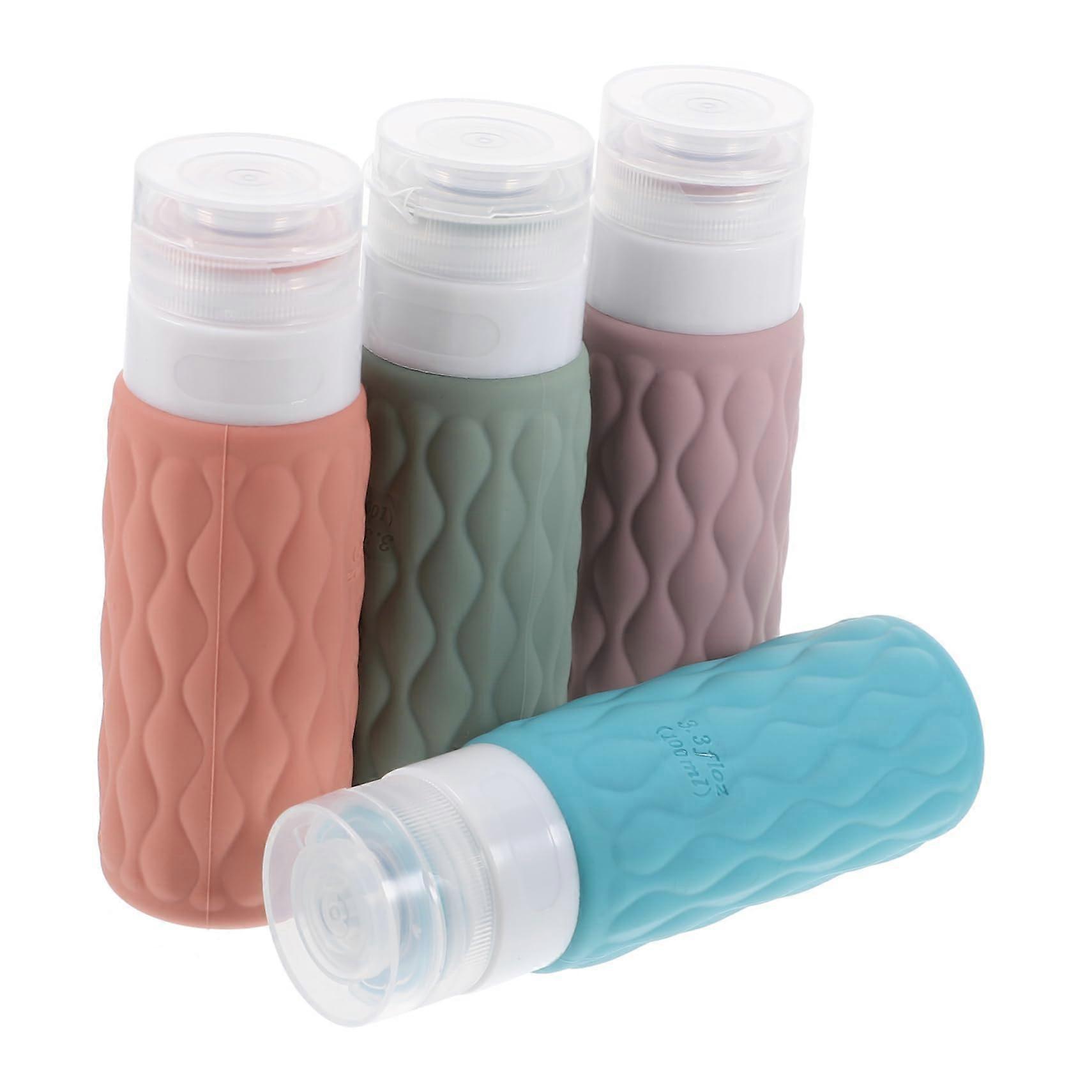 4Pcs Refillable Travel Bottles with Storage Bag Squeezable Toiletry Containers for Shampoo Conditioner