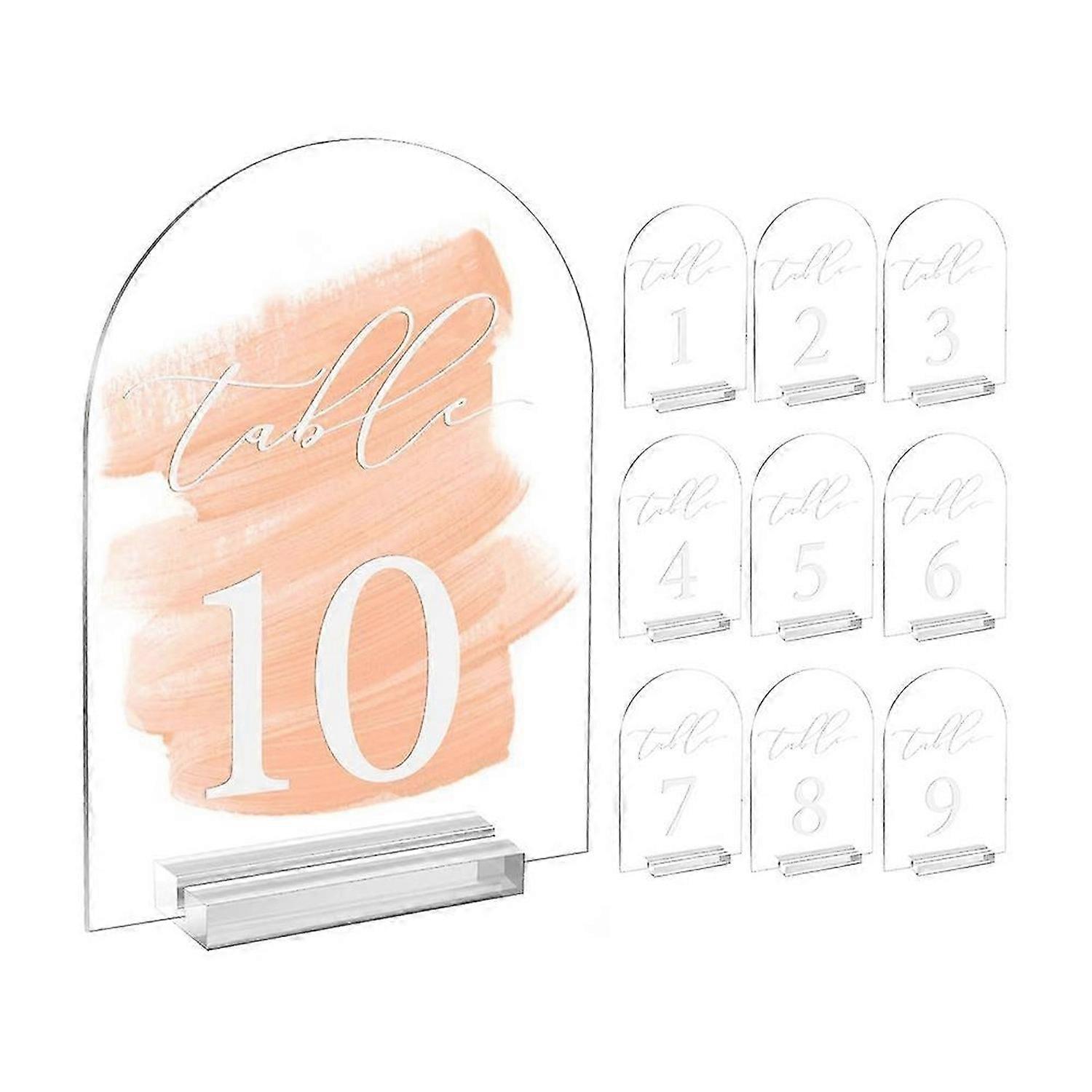 Numéros de table en arche transparente pour mariage