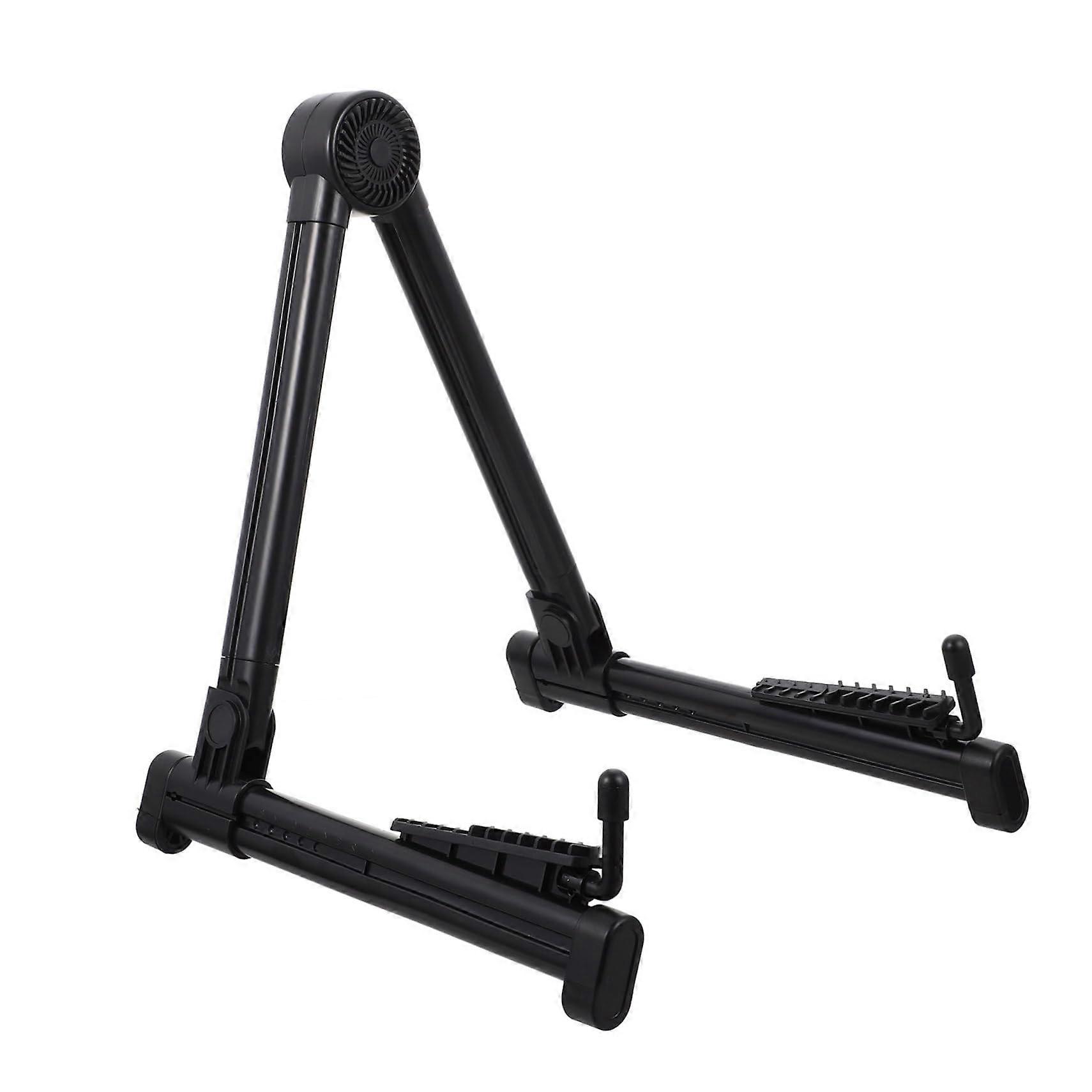 Foldable guitar stand with sturdy holder for guitar, violin, and ukulele, lightweight and portable for performances and easy storage.