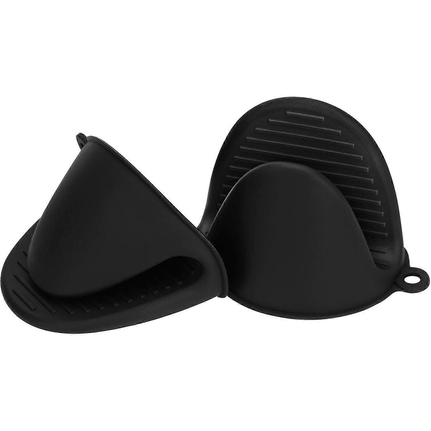 Set of mini black silicone potholders, perfect for safely handling hot cookware and bakeware.