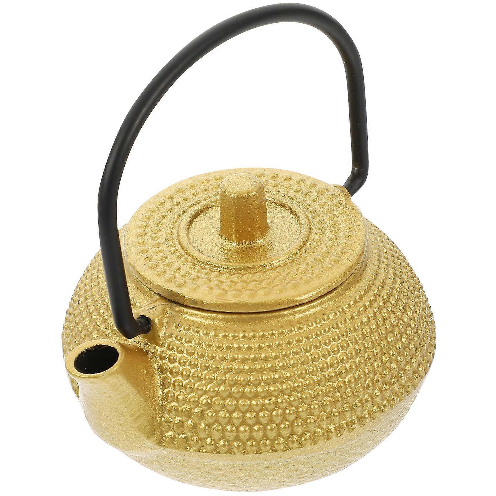 It sounds like you're describing or looking for a **small cast iron tea kettle or decorative teapot**. Here's a refined and more structured
