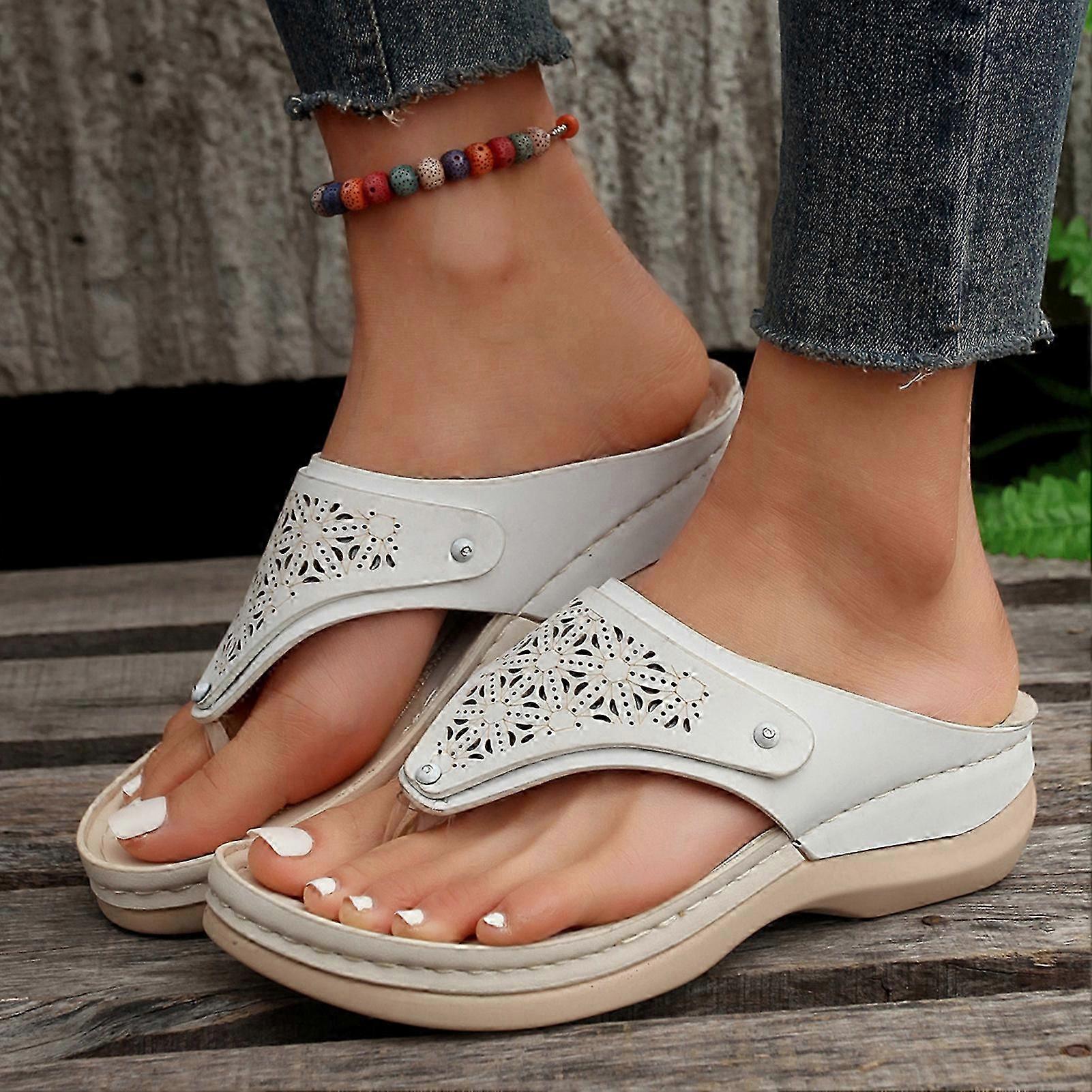 A Woman's Soft Leather, Solid Color Flip-Flop Sandal with an Open-Toe, for Outdoor Walking and Travelling