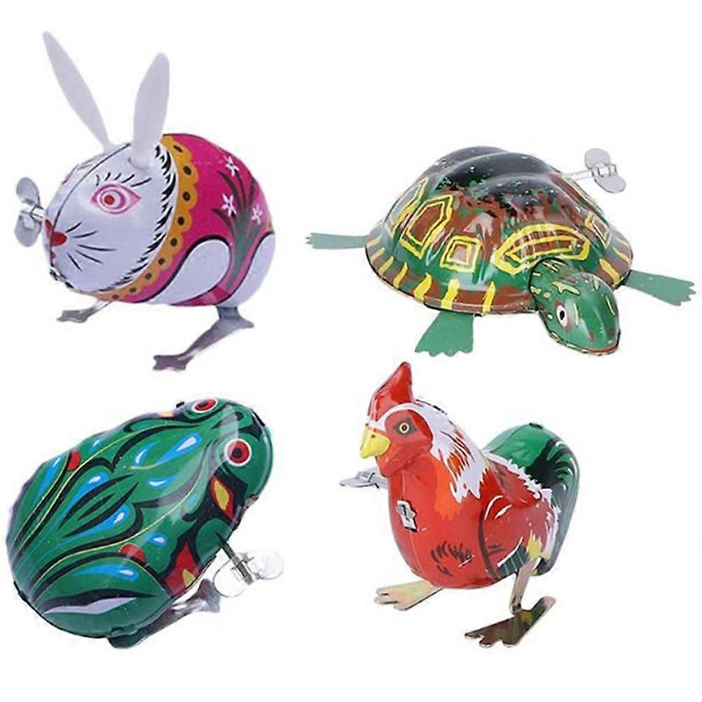 4pcs子供は時計仕掛けのおもちゃアイアンジャンピング動物のおもちゃ教育玩具を巻き上げます