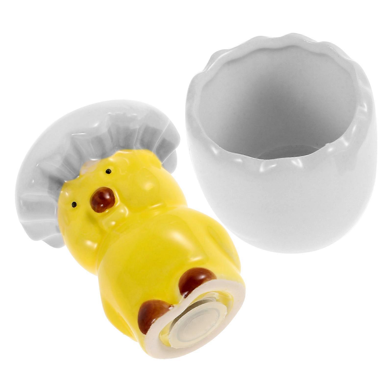 The **Ceramic Chicken Shaped Pepper Bottle with Silicone Base (White)** is a charming and functional kitchen accessory designed to enhance both home