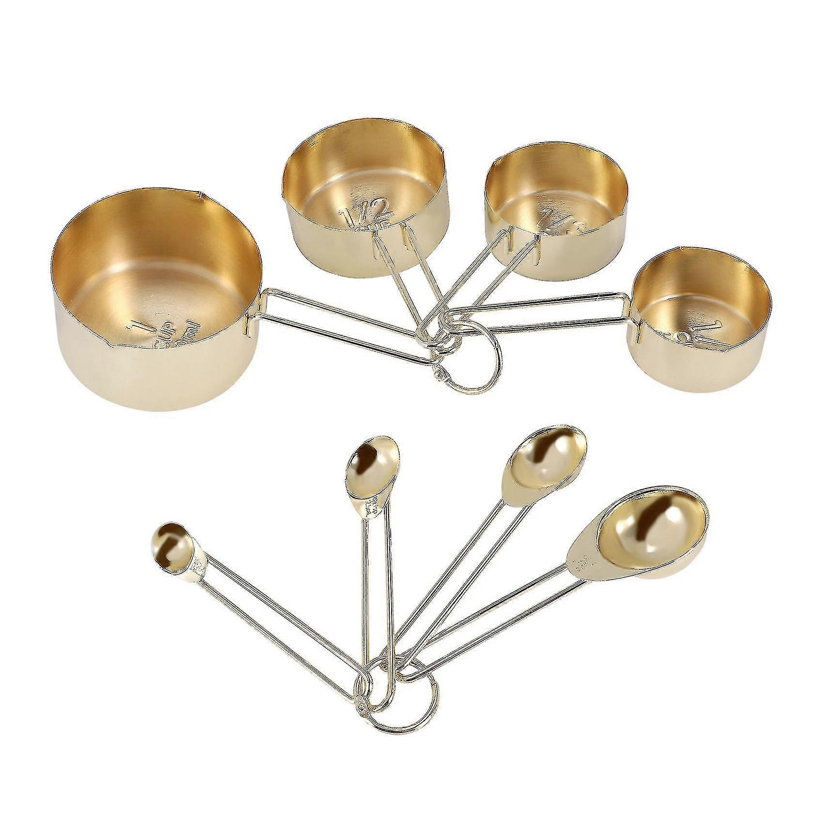 8-piece stainless steel measuring cup and spoon set with embedded scales and a golden appearance