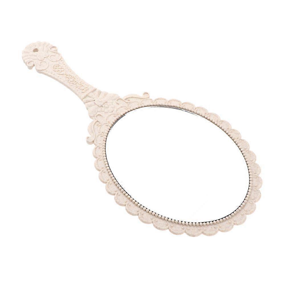 Antique pocket mirror with embossed rose design for beige make-up