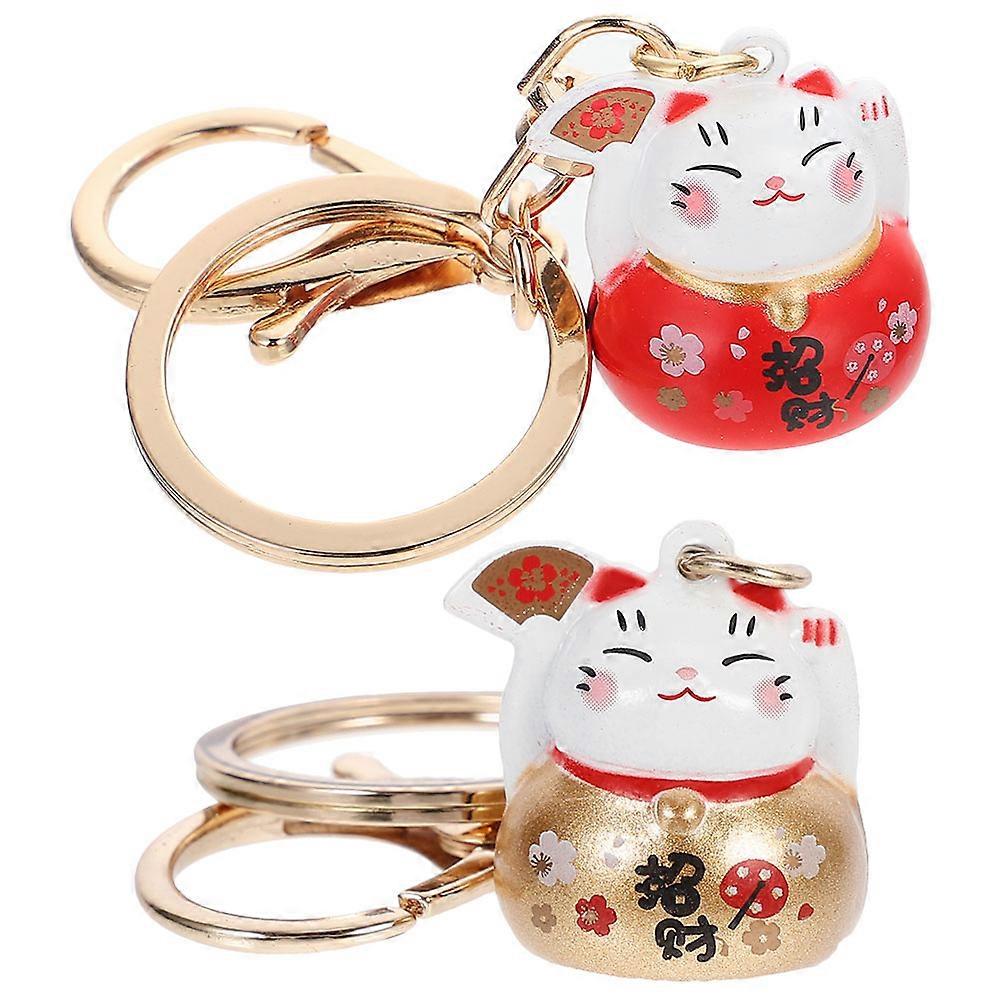 a polished and professional product description based on your input:

 

**2pcs Luck Cat Keychains – Durable Backpack Decorations with Waving Arm