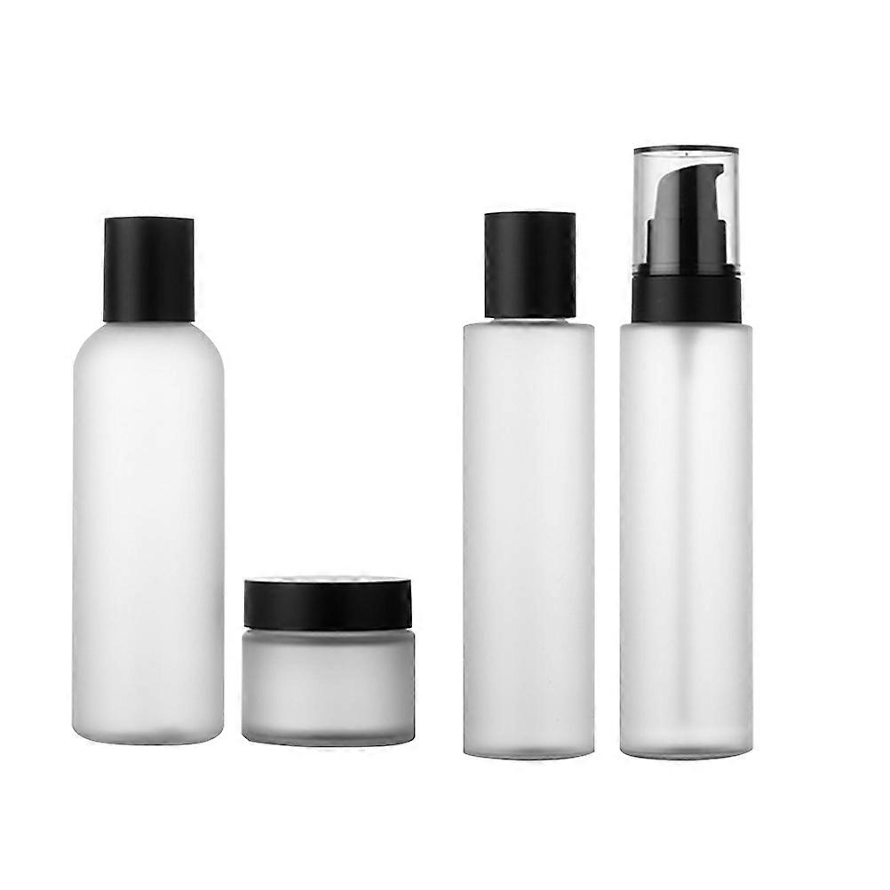 Portable Travel Bottles Set With White Cosmetic Cream Bottles For Daily Use And Travel Storage 4Pcs Mini Size Round Shape