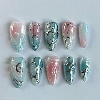 Faux ongles courts en acrylique, style français, bleu et rose amande, avec motif étoile argentée.