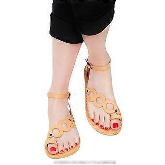 Aphrodite women's thong sandal with cross-circle patterns and ankle strap in natural coloured calfskin