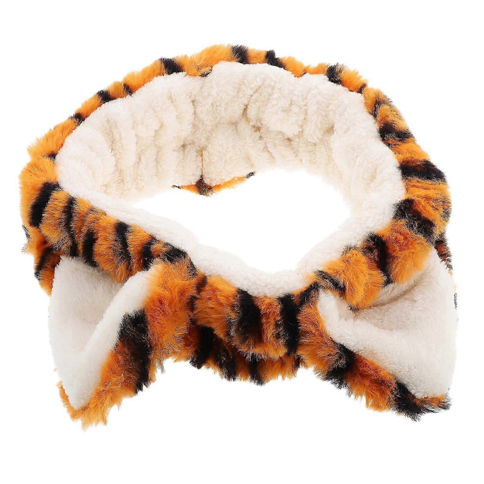 A Soft and Secure Plush Tiger Ears Headband for Kids' Parties and Face Washing.