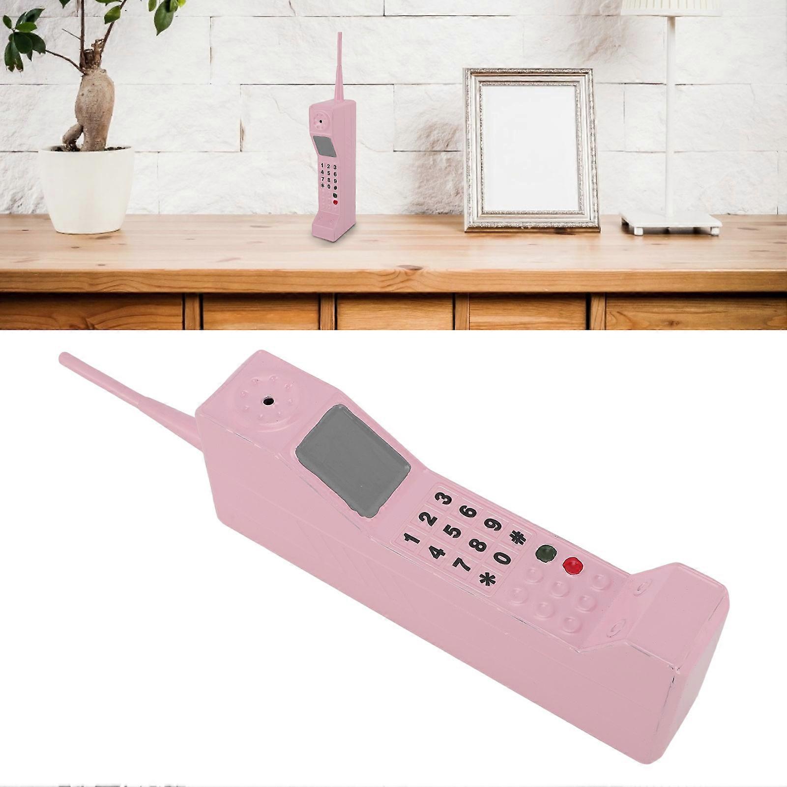 Ρετρό κινητό τηλέφωνο σιδήρου παλιομοδίτικο κινητό τηλέφωνο πρότυπο διακόσμηση για τη φωτογραφία ροζ 