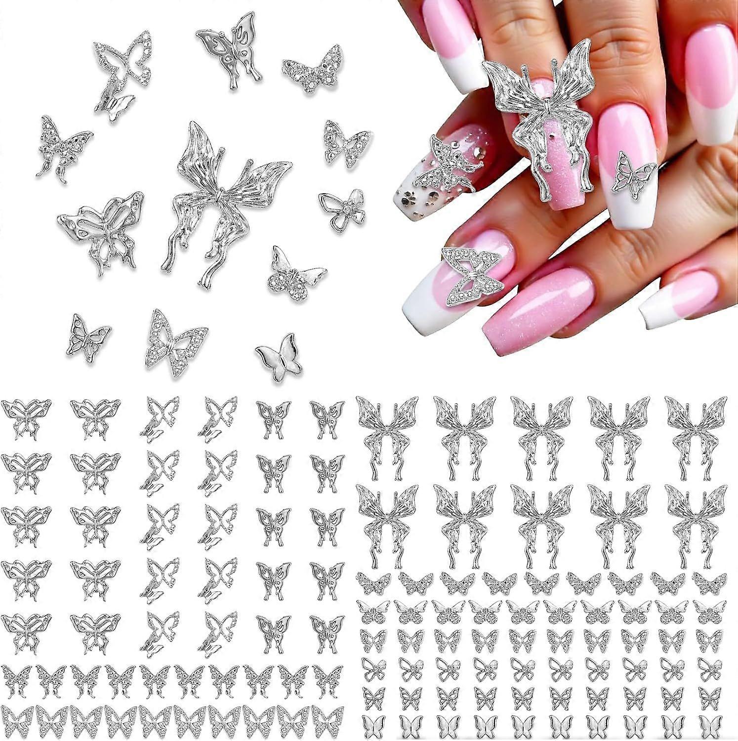 120個のバタフライネイルチャーム、DIYのためのシルバーバタフライラインストーンネイルジュエリー