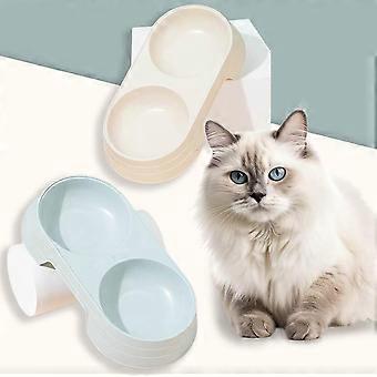 Two double cat feeding bowls, candy-colored, 21 x 10 x 4 cm, for holding food and water.