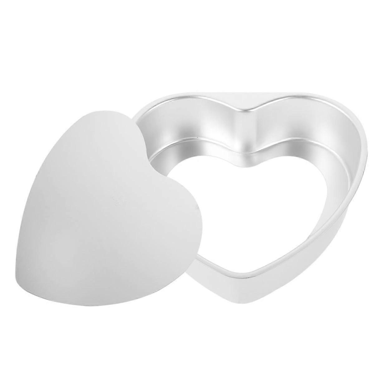 Heartshaped cake pan with removable bottom, nonstick for effortless baking
