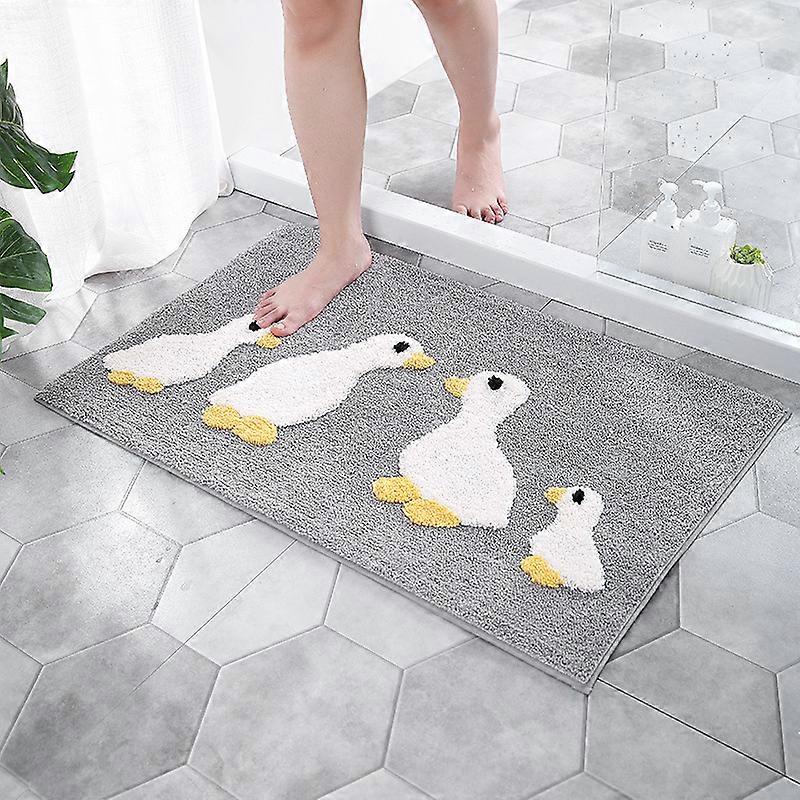 Cute duck bathroom mat is machine washable absorbent soft fluffy gray and cute duck is 24 inches long and 16 inches wide