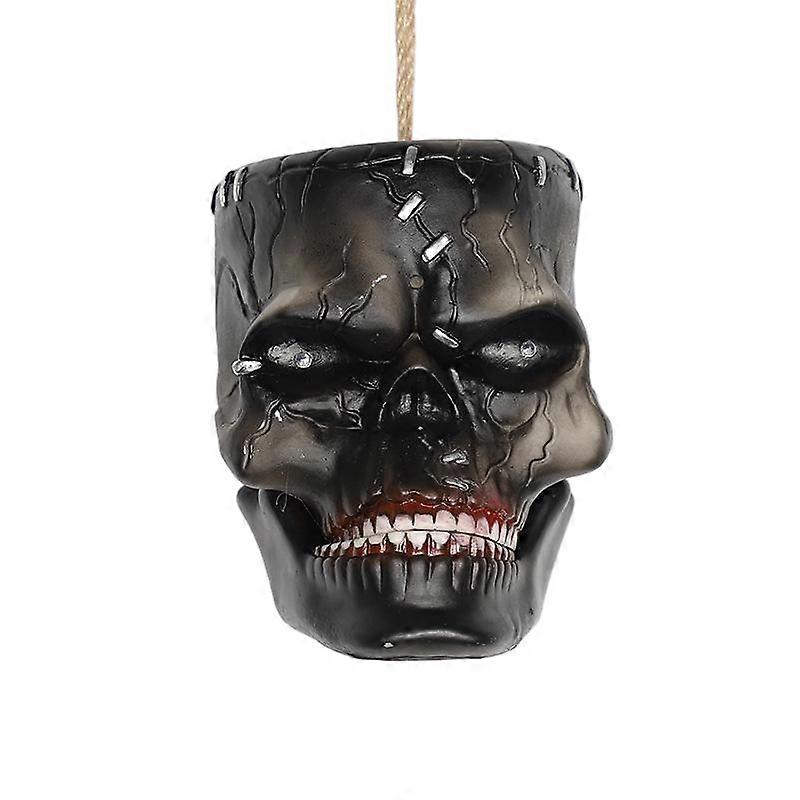 Electric sensor skull ghost head, made of plastic, automatically reacts when approached