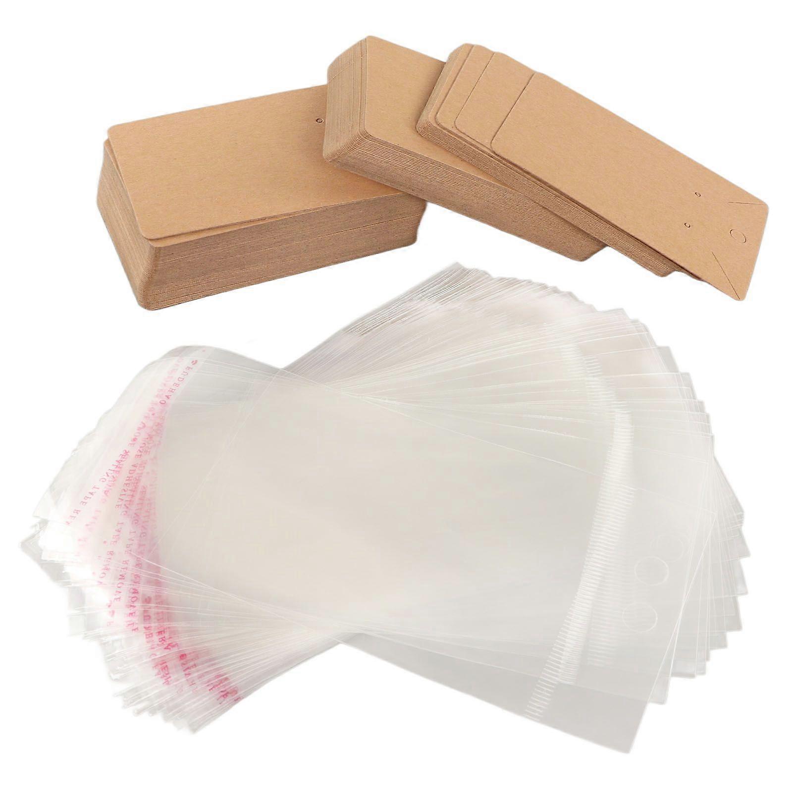 2025 أحدث طراز 100sets بطاقات القرط معلقة الثقوب تصميم حقيبة شفافة