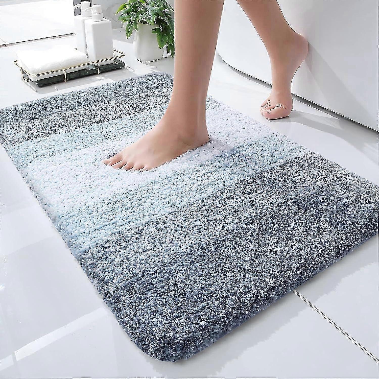 Plush bath mat for cozy bathrooms, absorbent 24x16 microfiber carpet