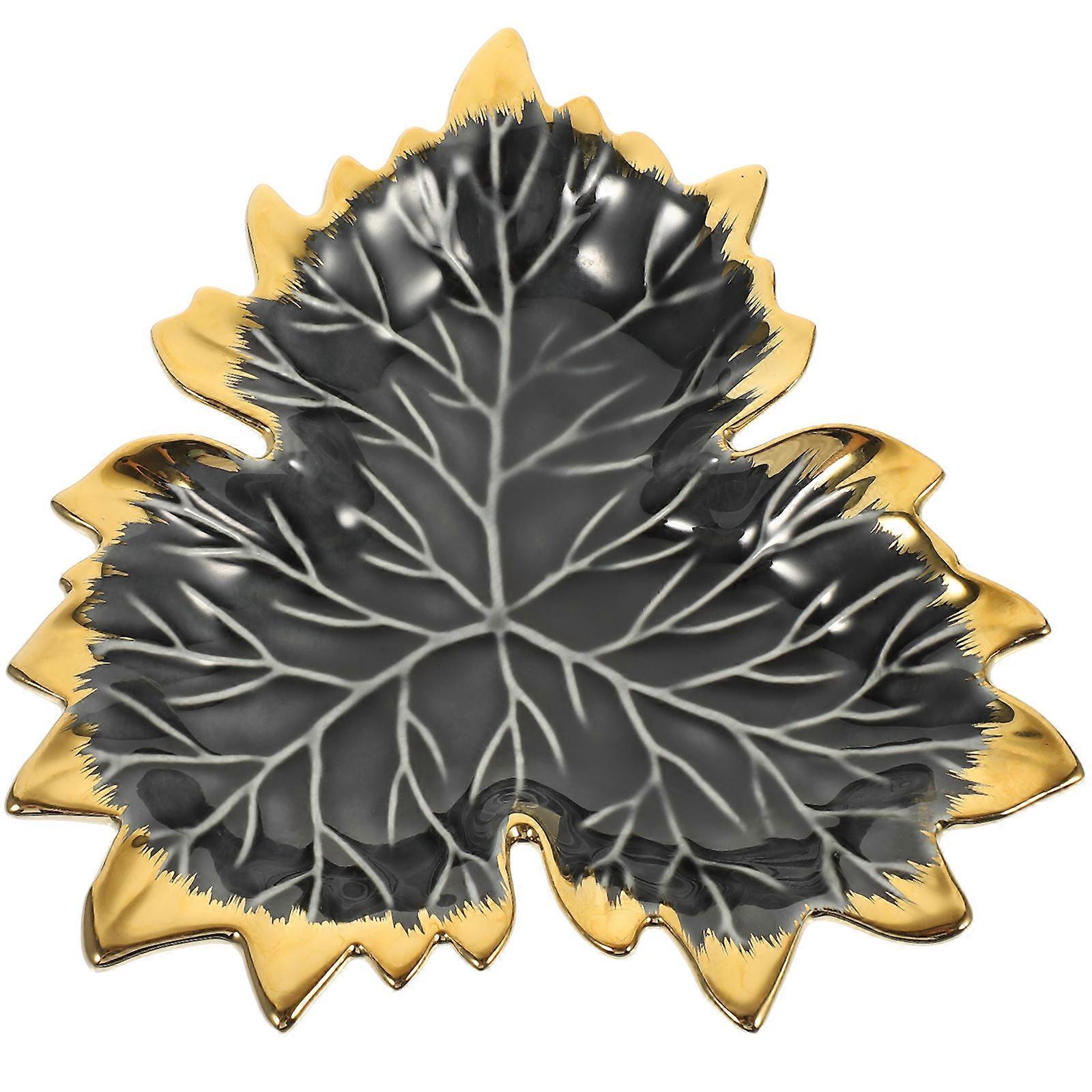 It sounds like you're describing a **multi functional leaf shaped ceramic plate** that serves both as a decorative item and an organizational tool