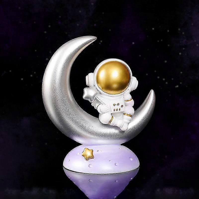 Luova astronautti Auton kotitoimiston kirjahyllyn koristeet