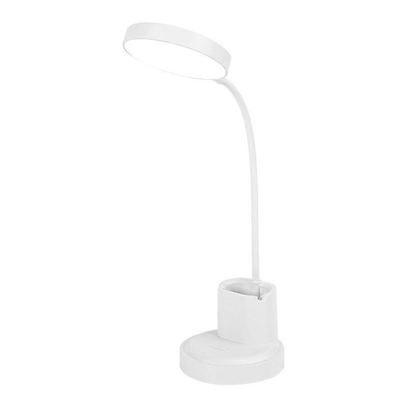 Opiskelija-asuntolan työpöytä, silmiensuojain, lamppu, sängyn vieressä lukeva led-kynänpidikelamppu