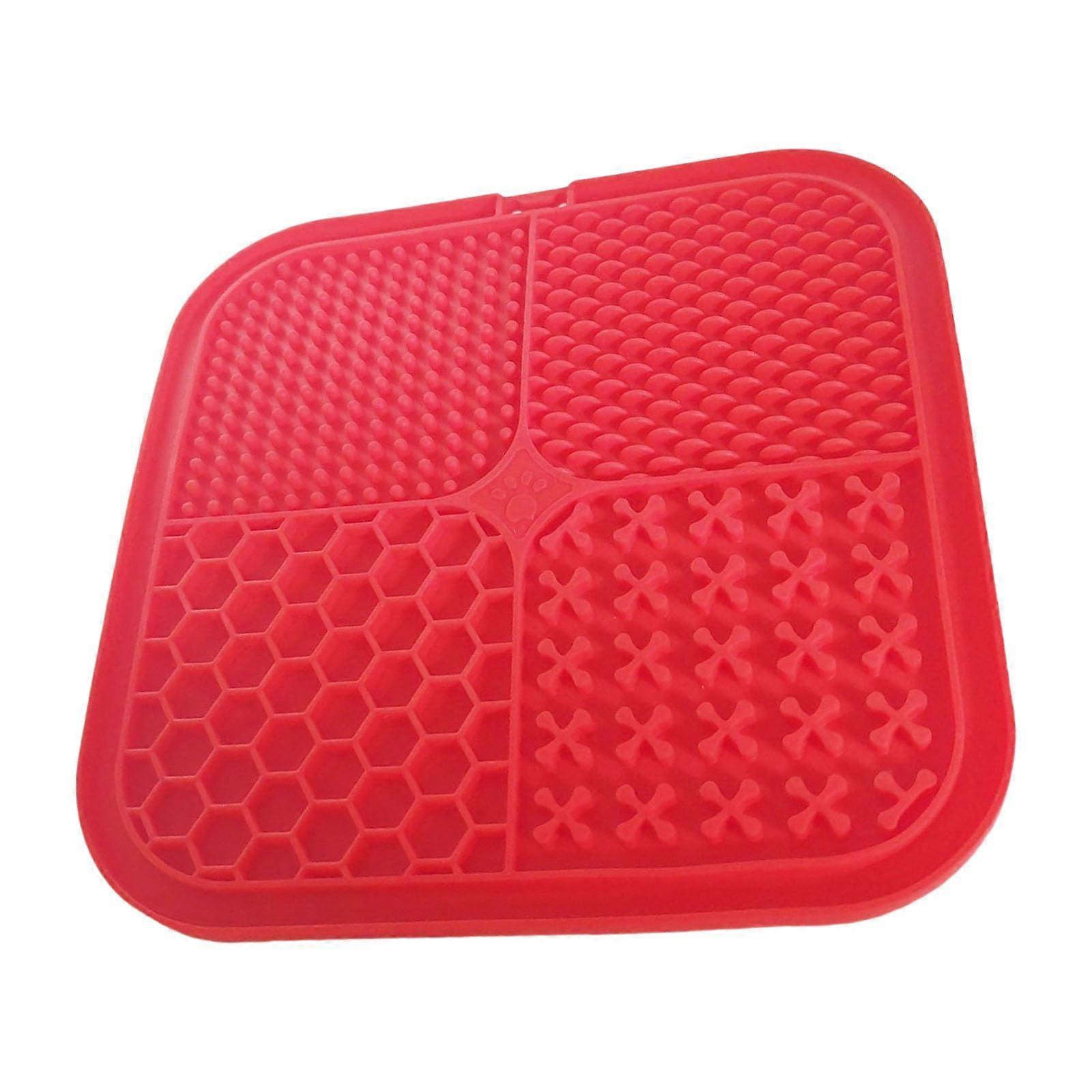 Stable pet feeding mats with textured surfaces and suction cups for prolonged meals, dishwashersafe lick mats in red.
