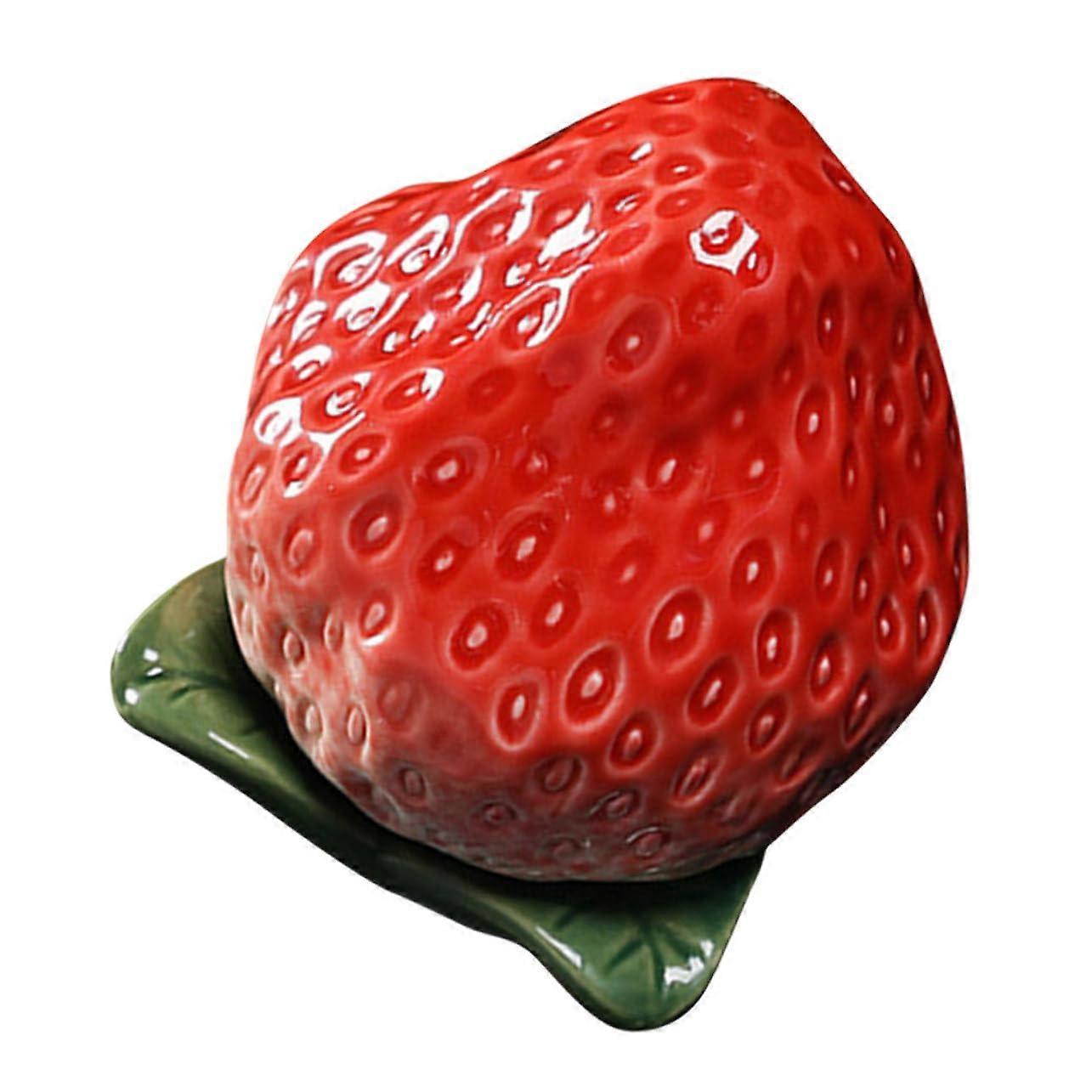 Decorative ceramic container in strawberry shape for storing tea and sweets, for stylish kitchen decor and creative touches