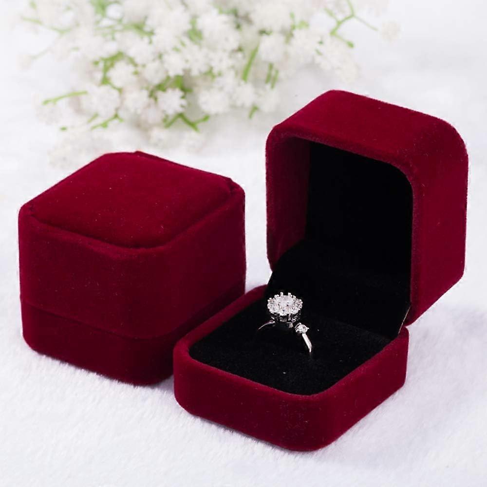 Two velvet ring boxes, wine