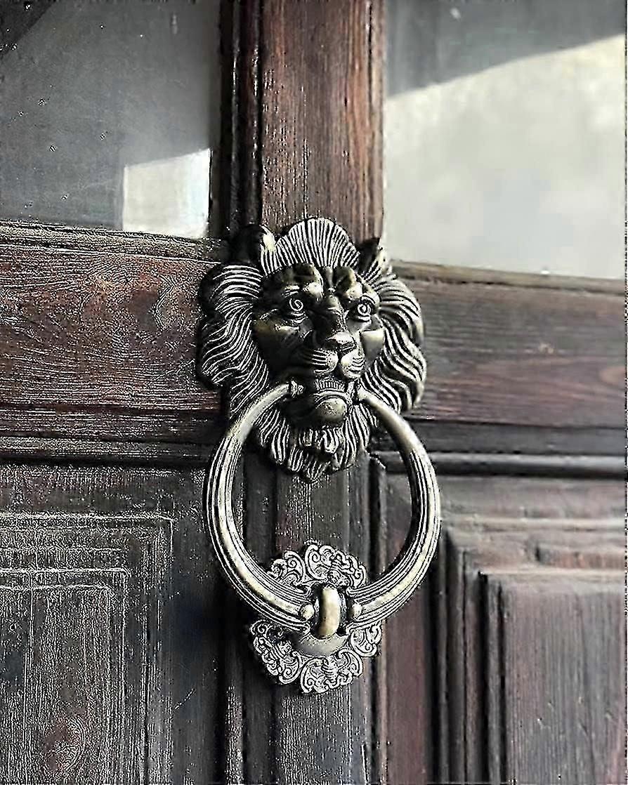 Door knocker in the shape of a Lions Head, Bronze