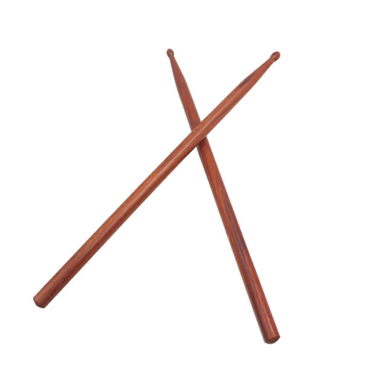 1 pair of drumsticks made of wood  
Oval wood tip  
For youth bands and drummers  
Balanced and comfortable playing feel  
Random color  
Random color