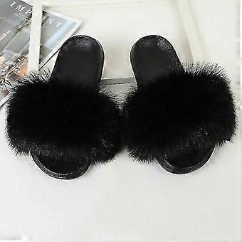 Platte slippers van pluizig bont voor dames, geschikt voor thuis en casual gebruik.