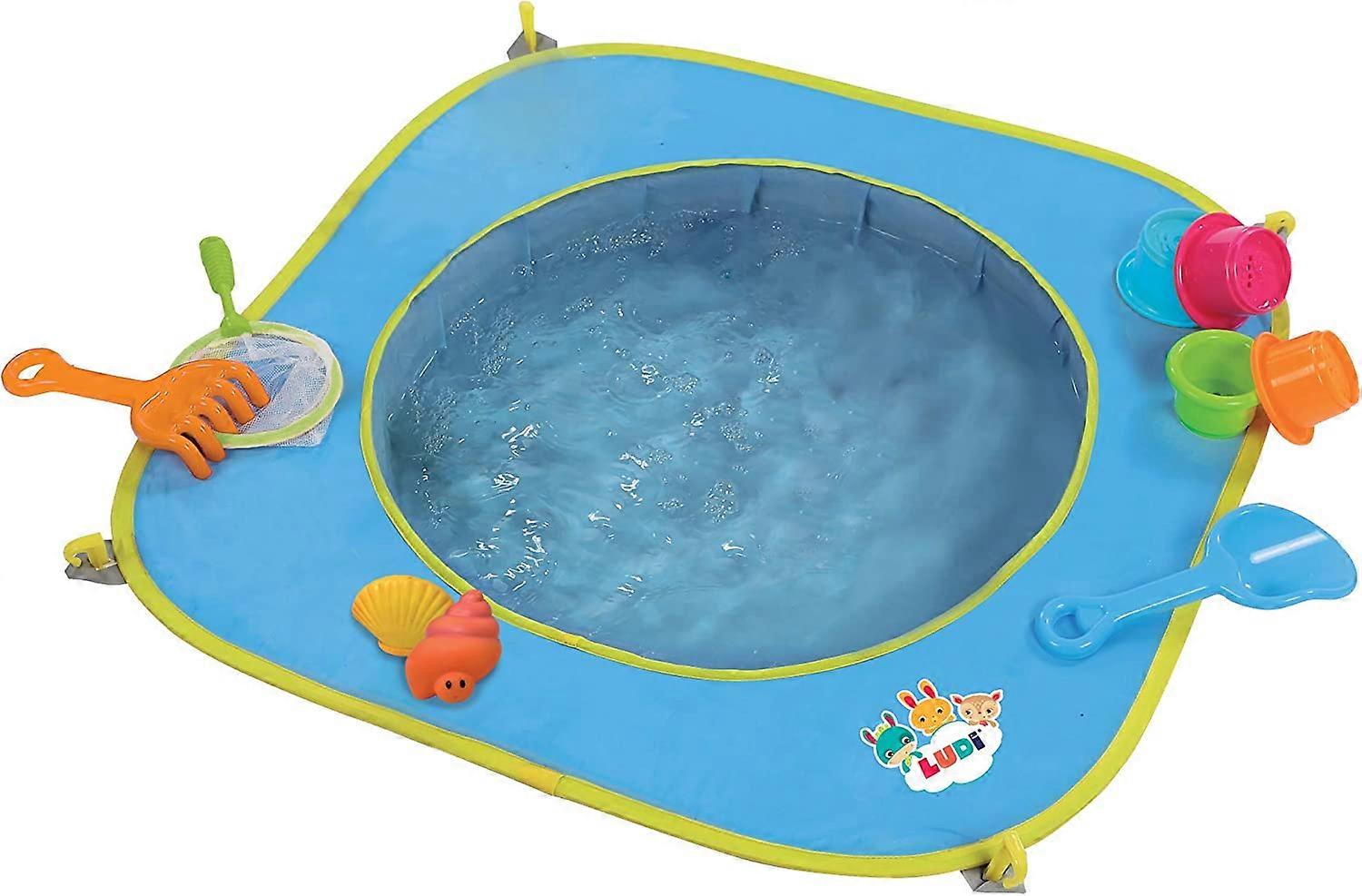 Piscine pour bb  la plage. Ds 10 mois. Inclus 9 jouets de plages. Structure pop-up lgre, se plie et se range facilement. Dimensions : 72 x 72 x 16 cm 