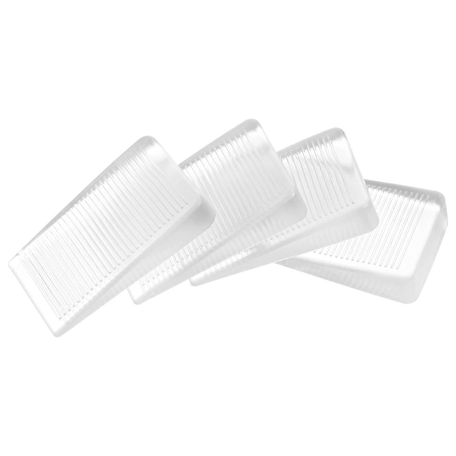Rubber door stoppers, wedgeshaped, thin, transparent, scratchresistant, 4 pieces.