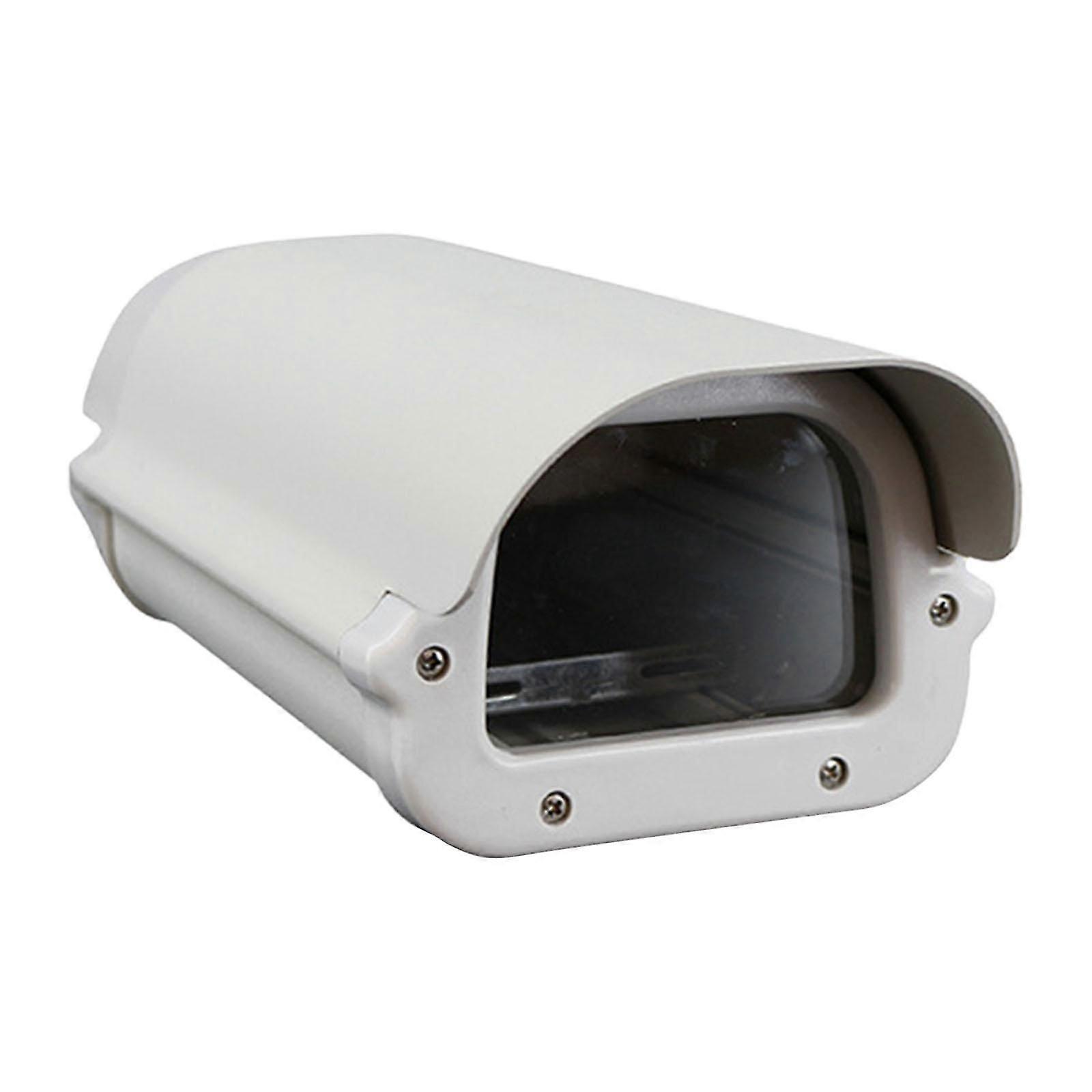 Outdoor shell for security camera with rain shield