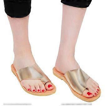 Women's handmade flat thong sandals in gold laminated calf leather
