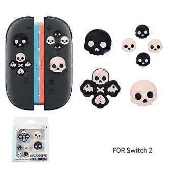 Copri pulsanti in silicone rosa con design a teschio per Nintendo Switch NS Lite.