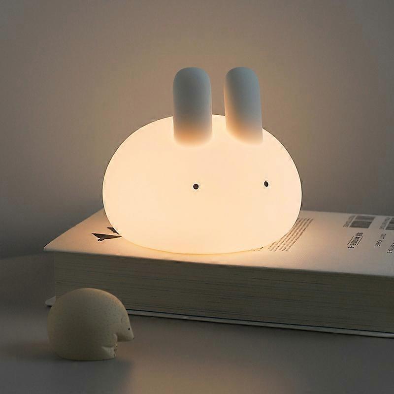 Timed warm light silicone night light